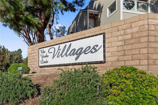 a sign broad in front of flowers