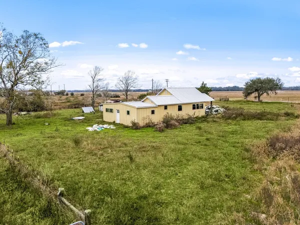 a view of a house with a yard porch and sitting area
