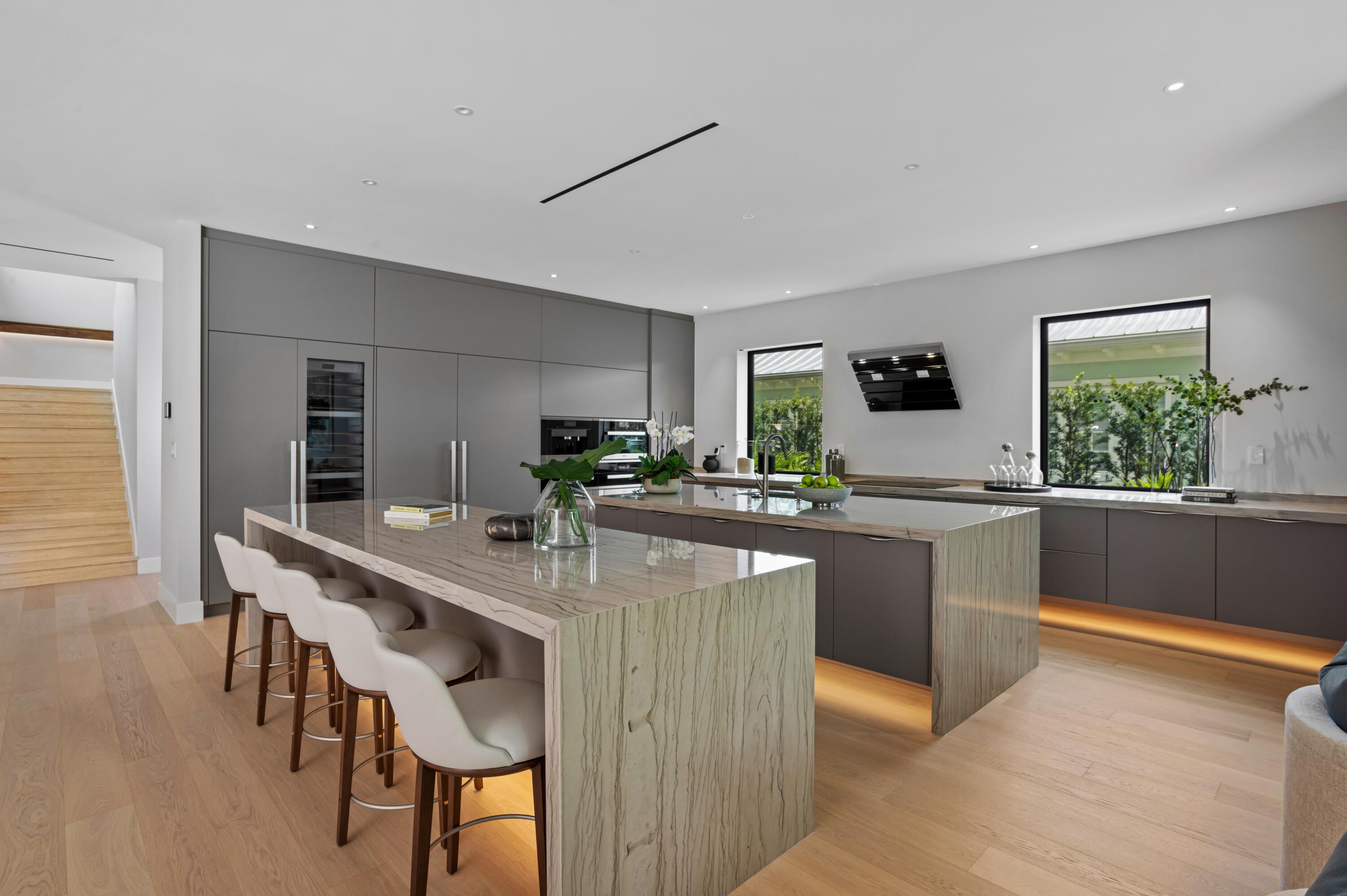 754 Oleander Street Boca Raton, FL 33486 - Photo 11 of 41 a kitchen with stainless steel appliances granite countertop counter space a sink and cabinets
