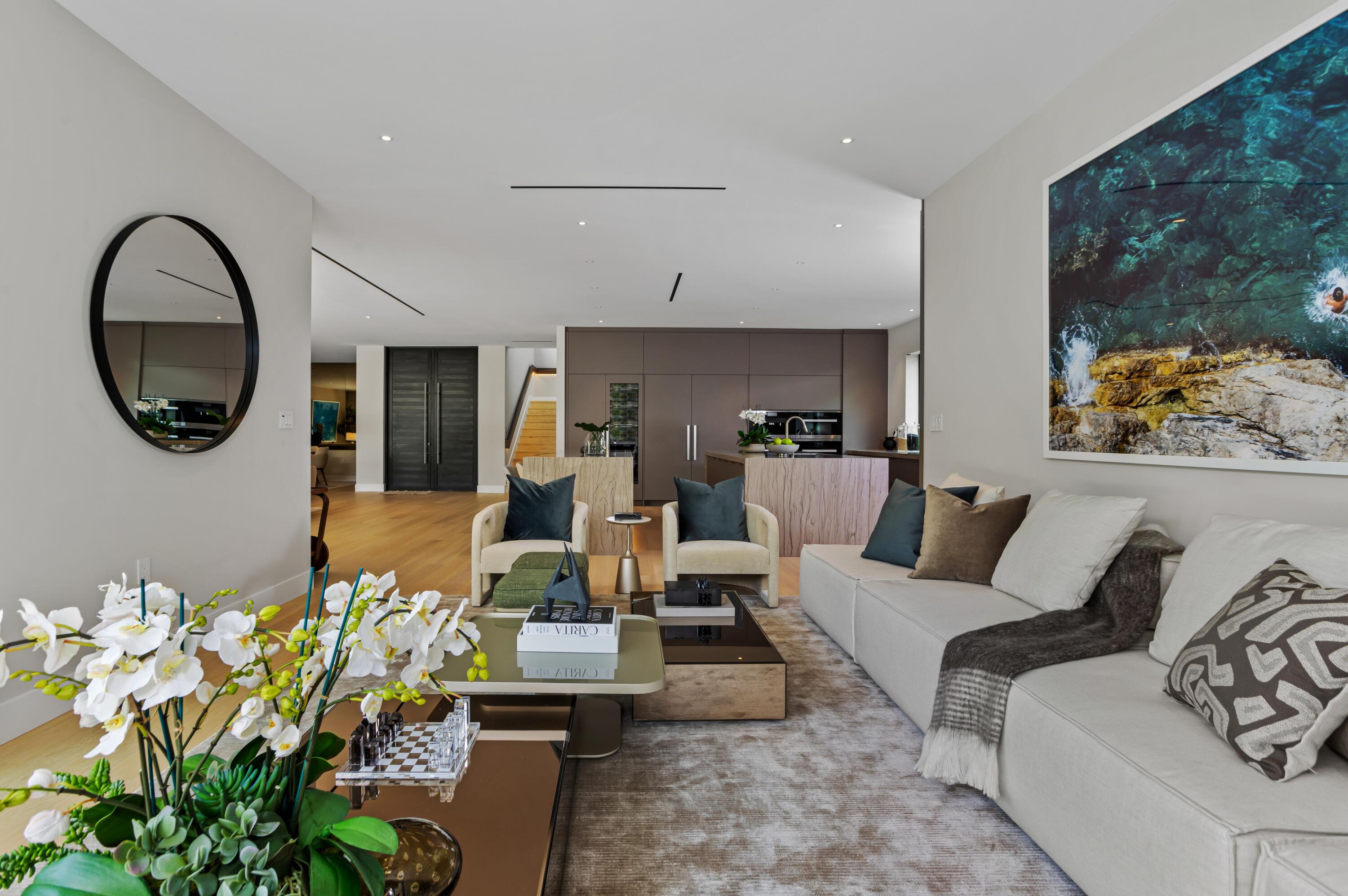 754 Oleander Street Boca Raton, FL 33486 - Photo 13 of 41 a living room with furniture a mirror and a potted plant