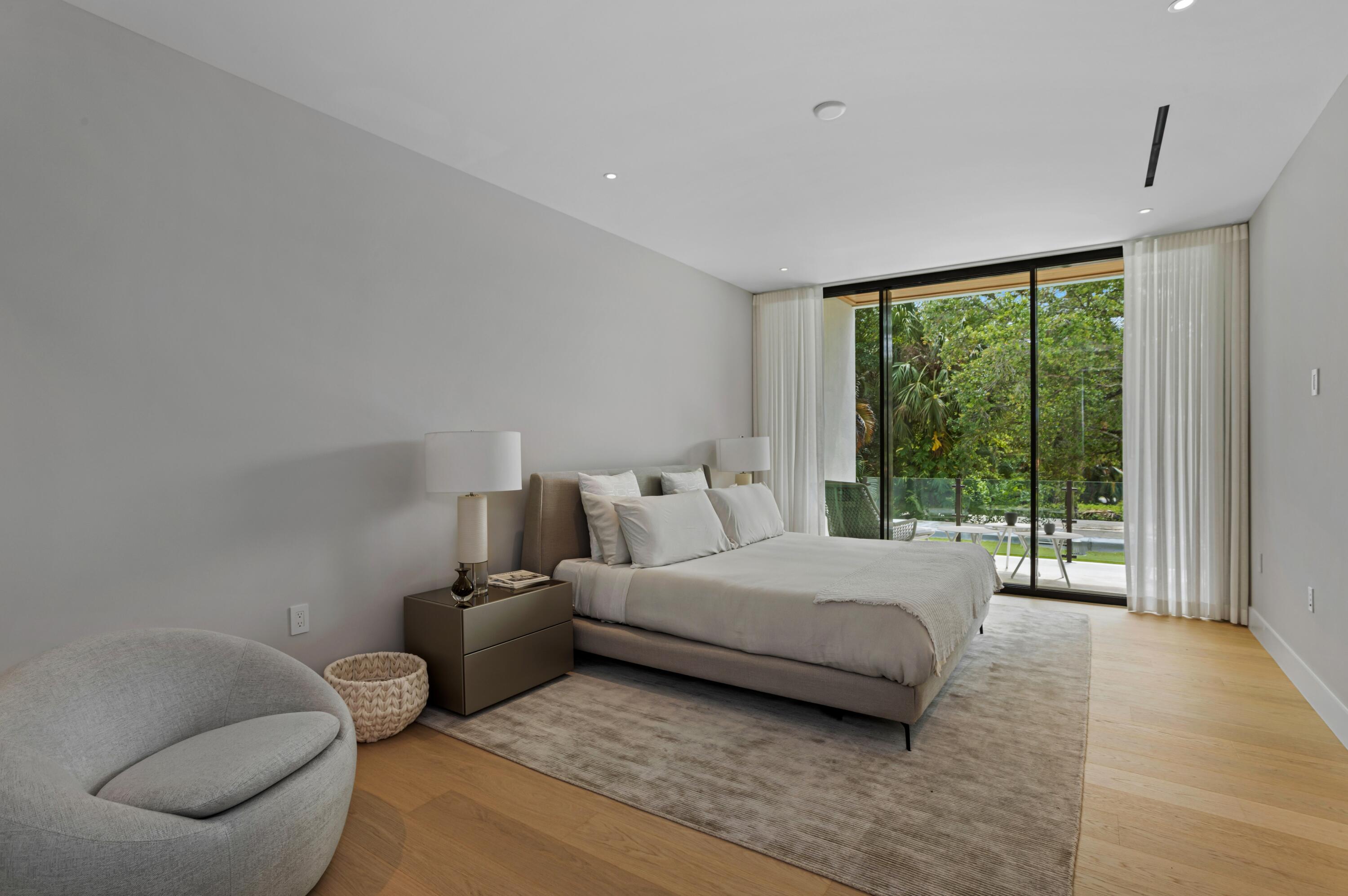 754 Oleander Street Boca Raton, FL 33486 - Photo 25 of 41 a bedroom with a bed and large window