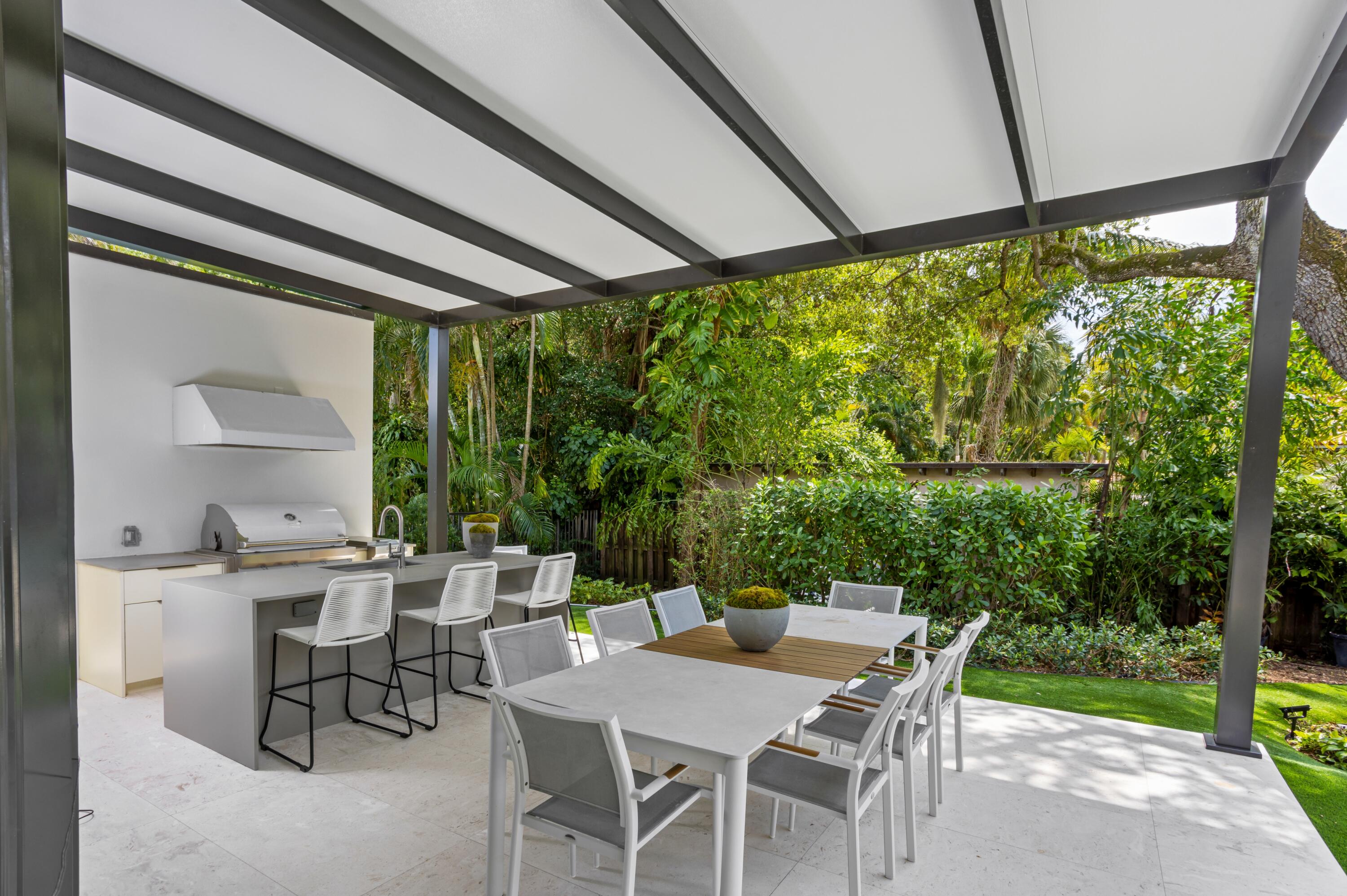 754 Oleander Street Boca Raton, FL 33486 - Photo 34 of 41 a view of an outdoor dining space with a table and chairs