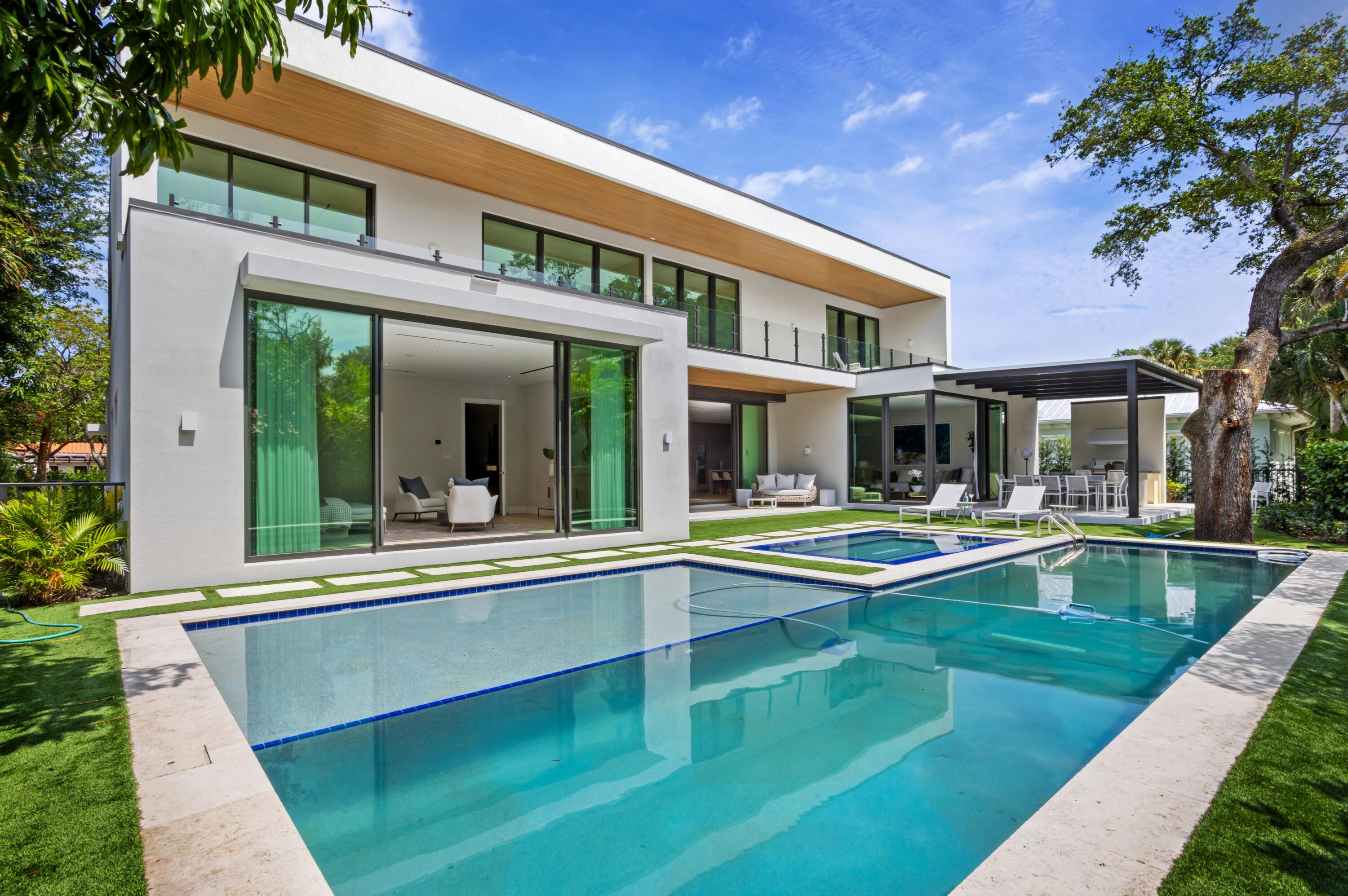 754 Oleander Street Boca Raton, FL 33486 - Photo 37 of 41 a view of an house with swimming pool and porch