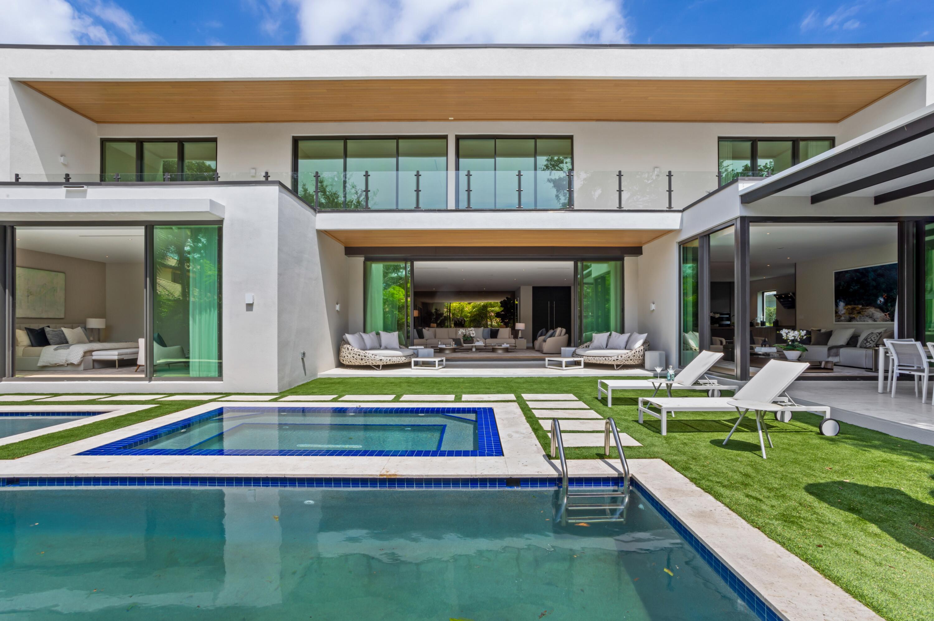 754 Oleander Street Boca Raton, FL 33486 - Photo 38 of 41 a view of swimming pool with lawn chairs and plants