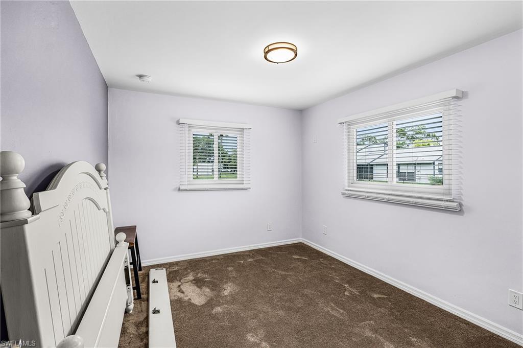 34 Hamlin Court Lehigh Acres, FL 33936 - Photo 16 of 29 a view of a livingroom with a window