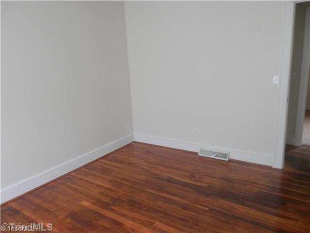 1032 Forsyth Line Road Rural Hall, NC 27045 - Photo 8 of 10 2nd Bedroom. Second bedroom with wood floors.