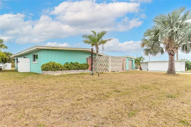 a view of a house with a yard and garage