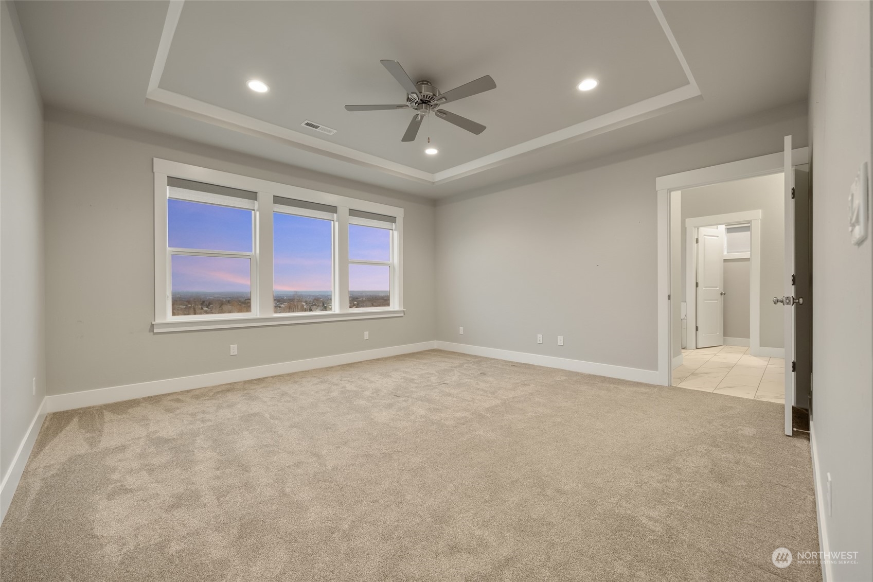 5307 South Kent Street Kennewick, WA 99337 - Photo 14 of 40 an empty room with ceiling fan and windows