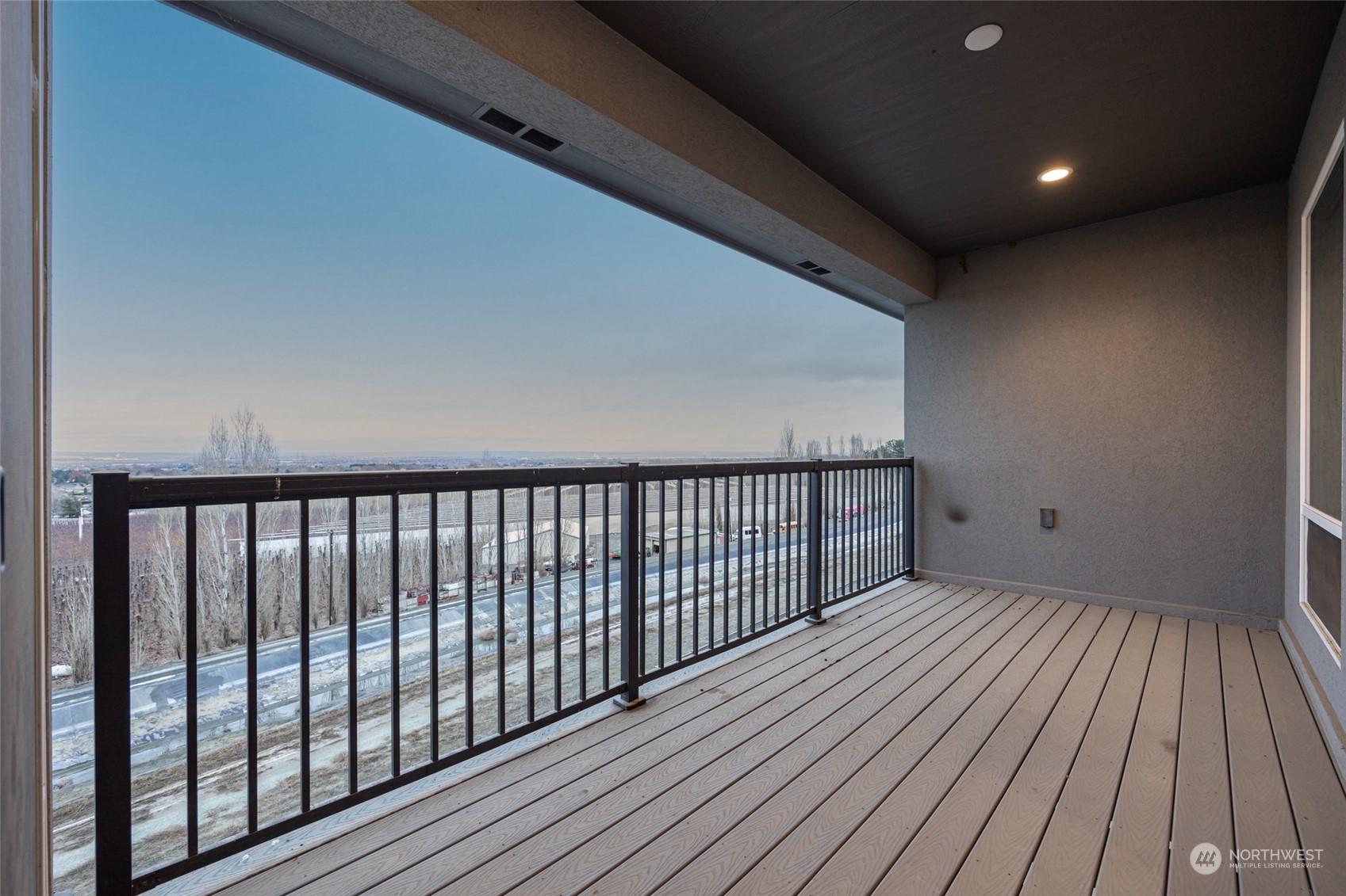 5307 South Kent Street Kennewick, WA 99337 - Photo 22 of 40 a view of balcony with wooden floor