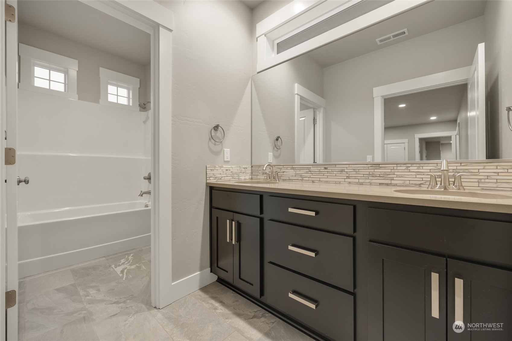 5307 South Kent Street Kennewick, WA 99337 - Photo 9 of 40 a bathroom with a granite countertop sink mirror and bathtub