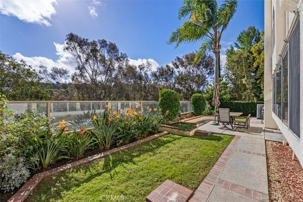 a view of a backyard with sitting area