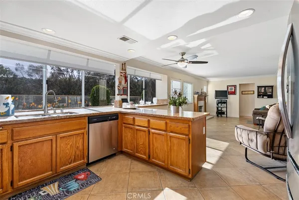 a large living space with granite countertop furniture and a sink