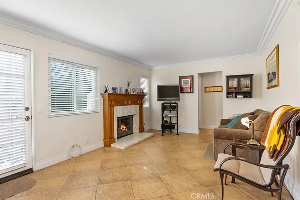 a view of a livingroom with a fireplace and a window