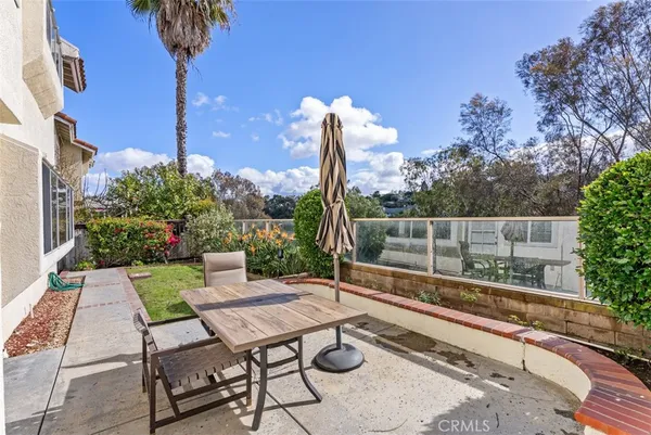 a view of a backyard with sitting area