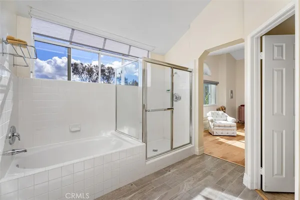 a bathroom with a tub and shower