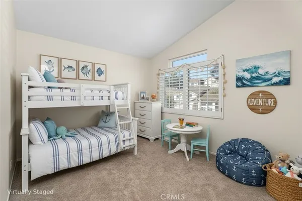a living room with furniture and a chair