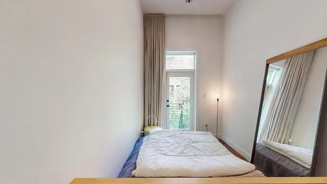 a bathroom with a granite countertop sink a shower and a mirror