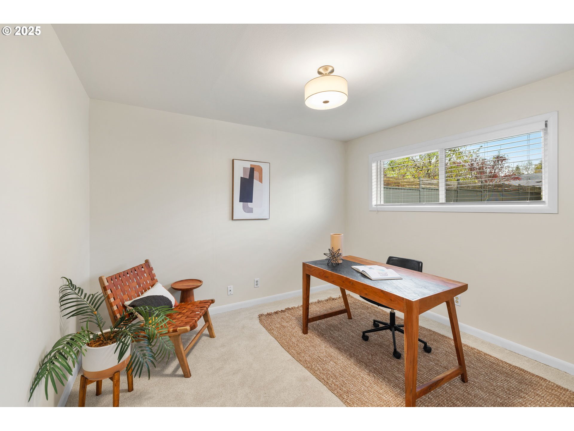 7643 Southeast Market Street Portland, OR 97215 - Photo 12 of 34 a work room with furniture and a painting on the wall