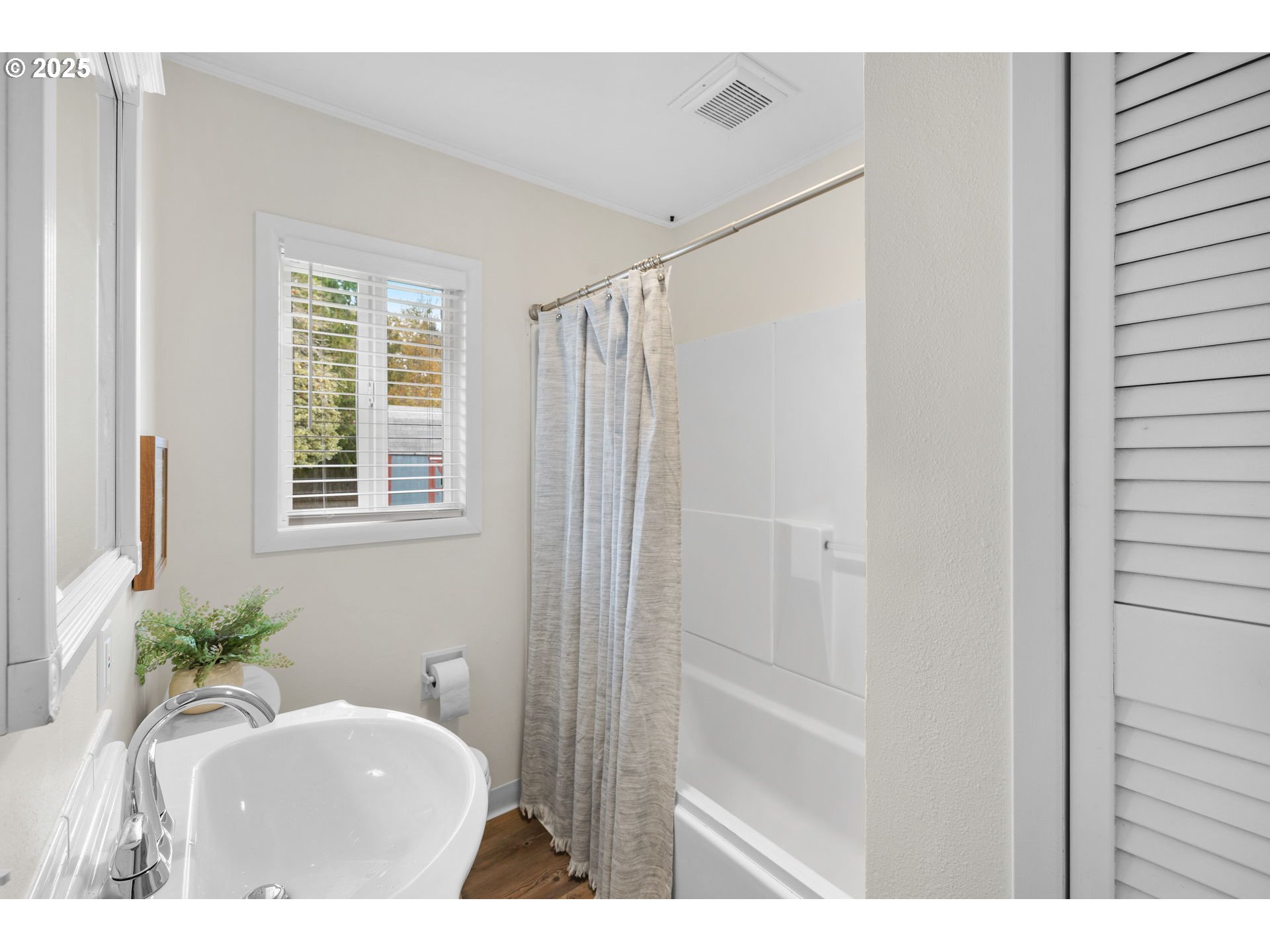7643 Southeast Market Street Portland, OR 97215 - Photo 14 of 34 a bathroom with a sink and a mirror