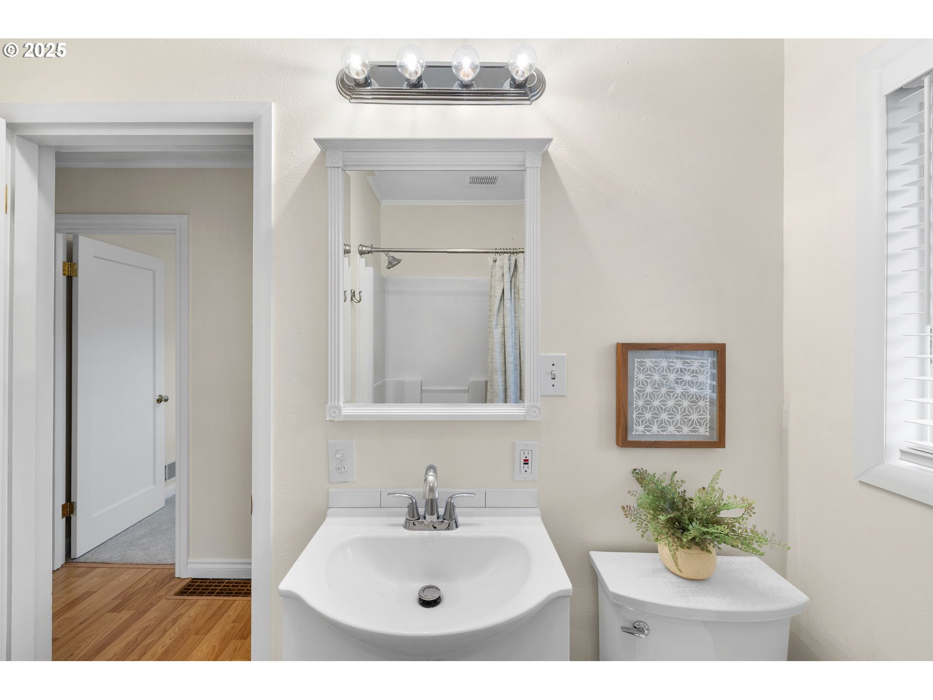 7643 Southeast Market Street Portland, OR 97215 - Photo 15 of 34 a bathroom with a sink and a mirror