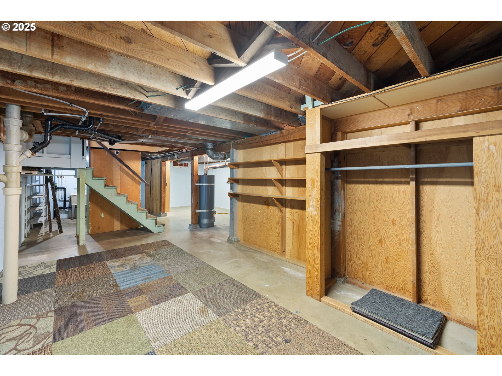 7643 Southeast Market Street Portland, OR 97215 - Photo 19 of 34 a view of an empty room with wooden floor