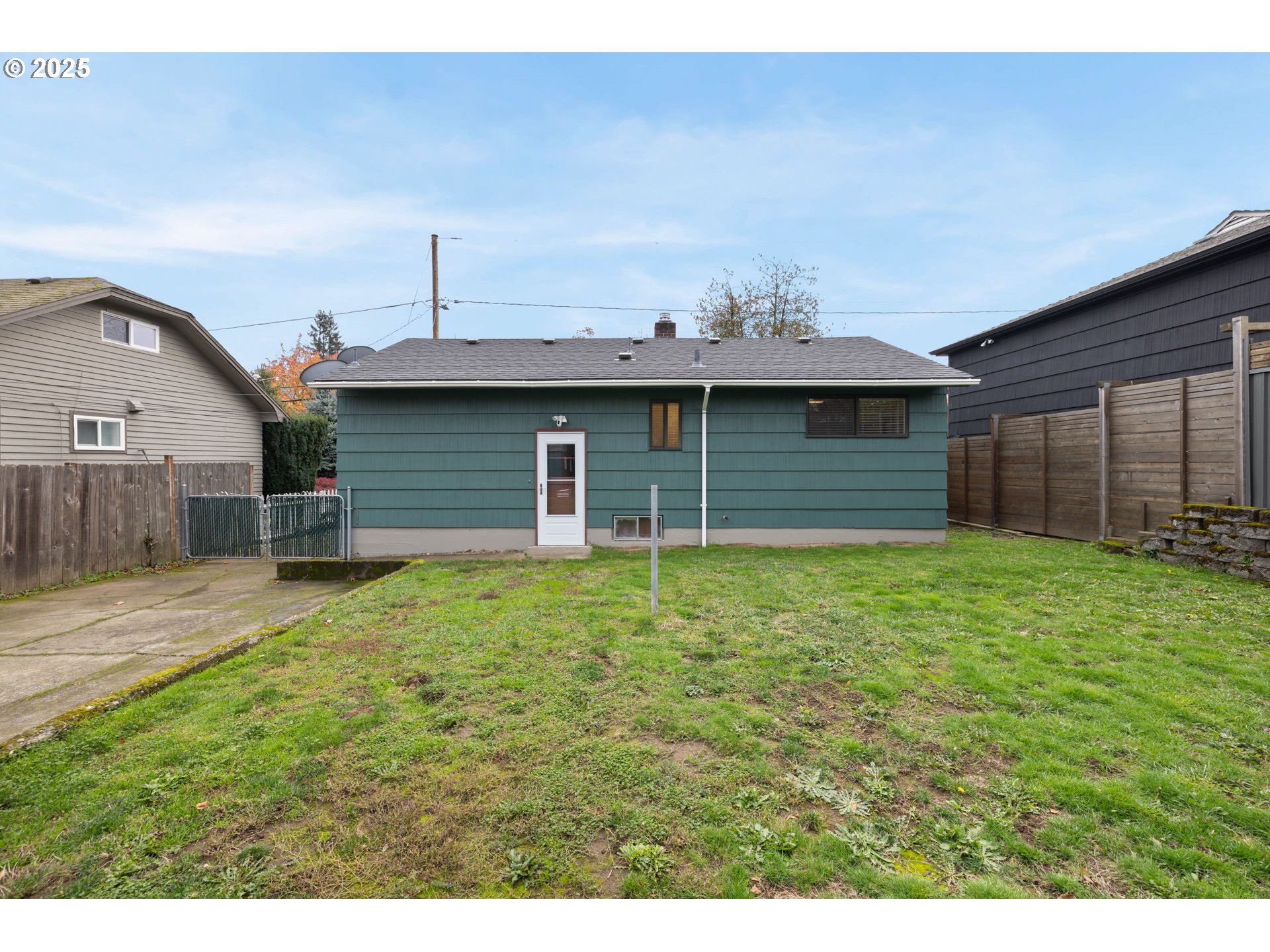 7643 Southeast Market Street Portland, OR 97215 - Photo 30 of 34 a front view of a house with a garden