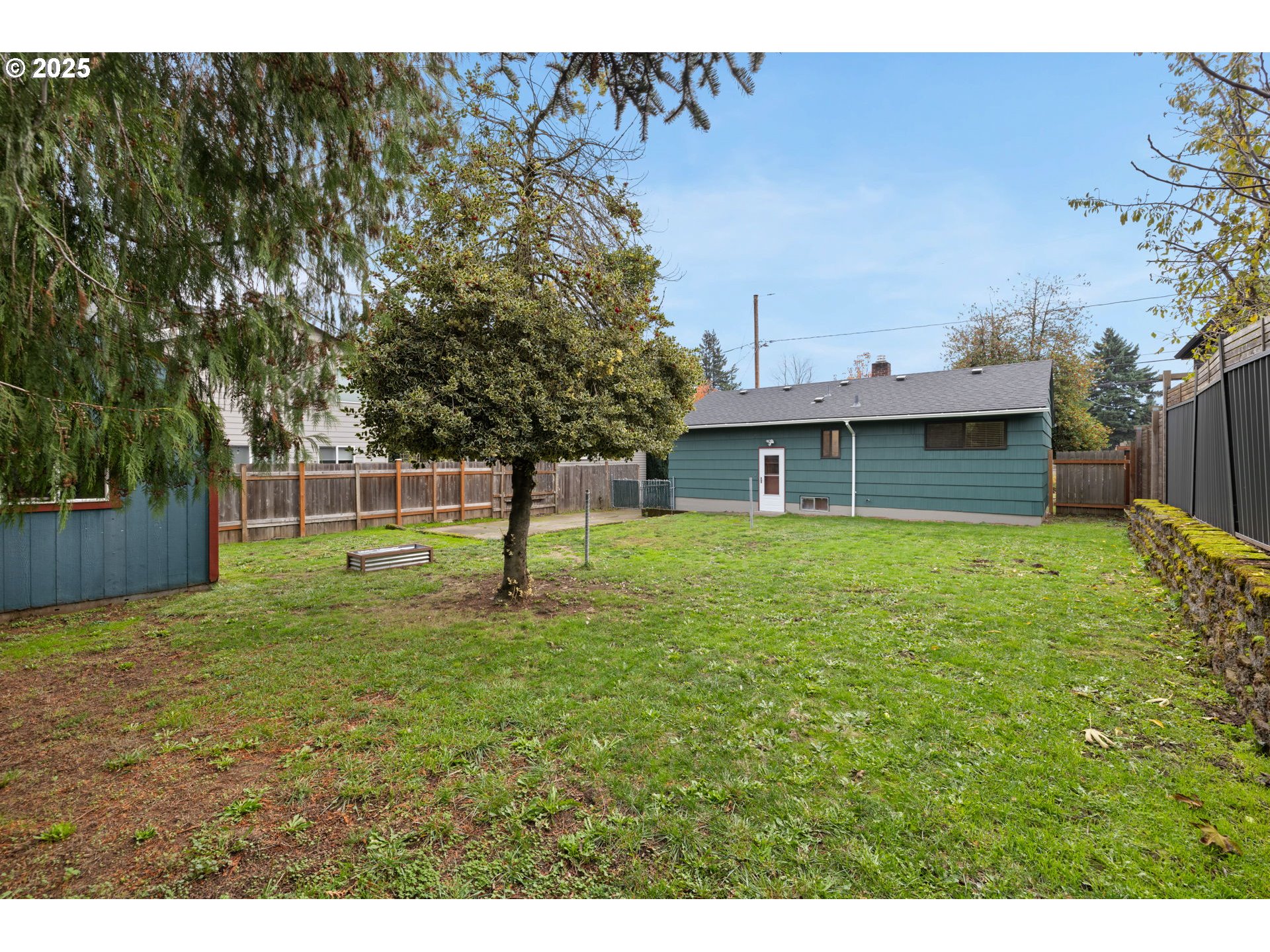 7643 Southeast Market Street Portland, OR 97215 - Photo 31 of 34 a front view of a house with a yard
