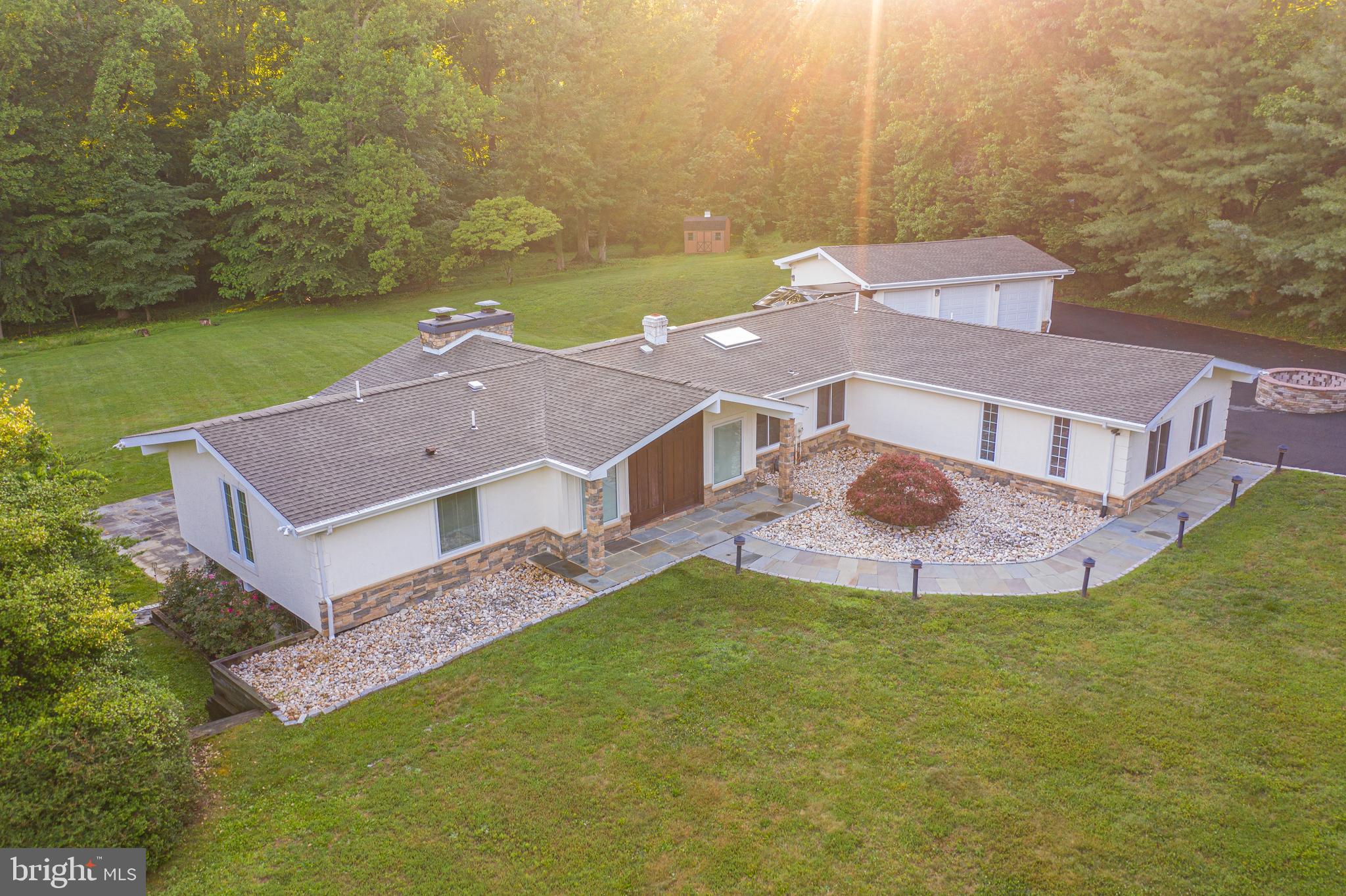an aerial view of residential houses with outdoor space and swimming pool
