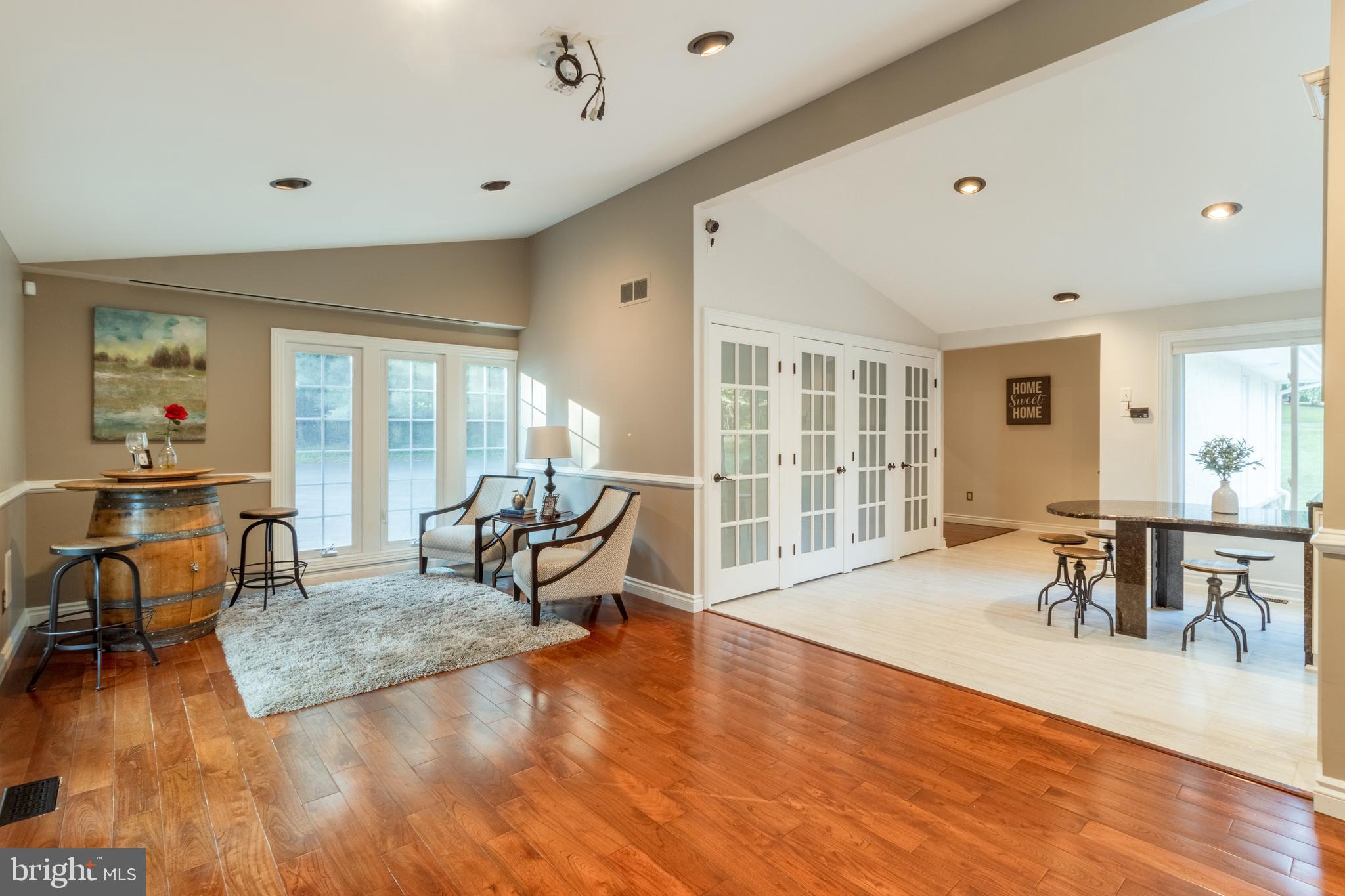 5402 Kennett Pike Wilmington, DE 19807 - Photo 20 of 81 a living room with furniture a wooden floor and a large window