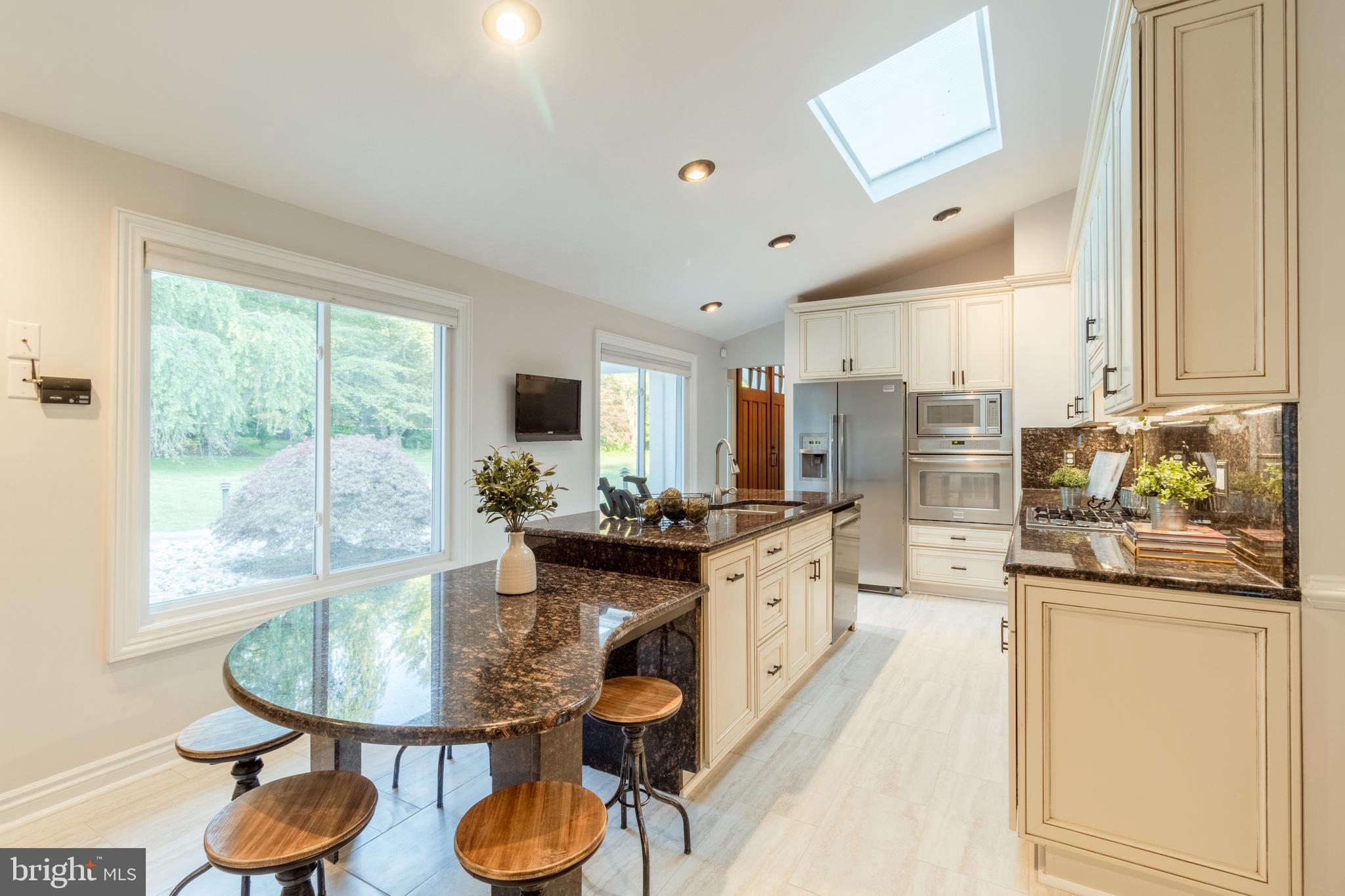 5402 Kennett Pike Wilmington, DE 19807 - Photo 23 of 81 a kitchen with stainless steel appliances granite countertop a stove a sink and a refrigerator