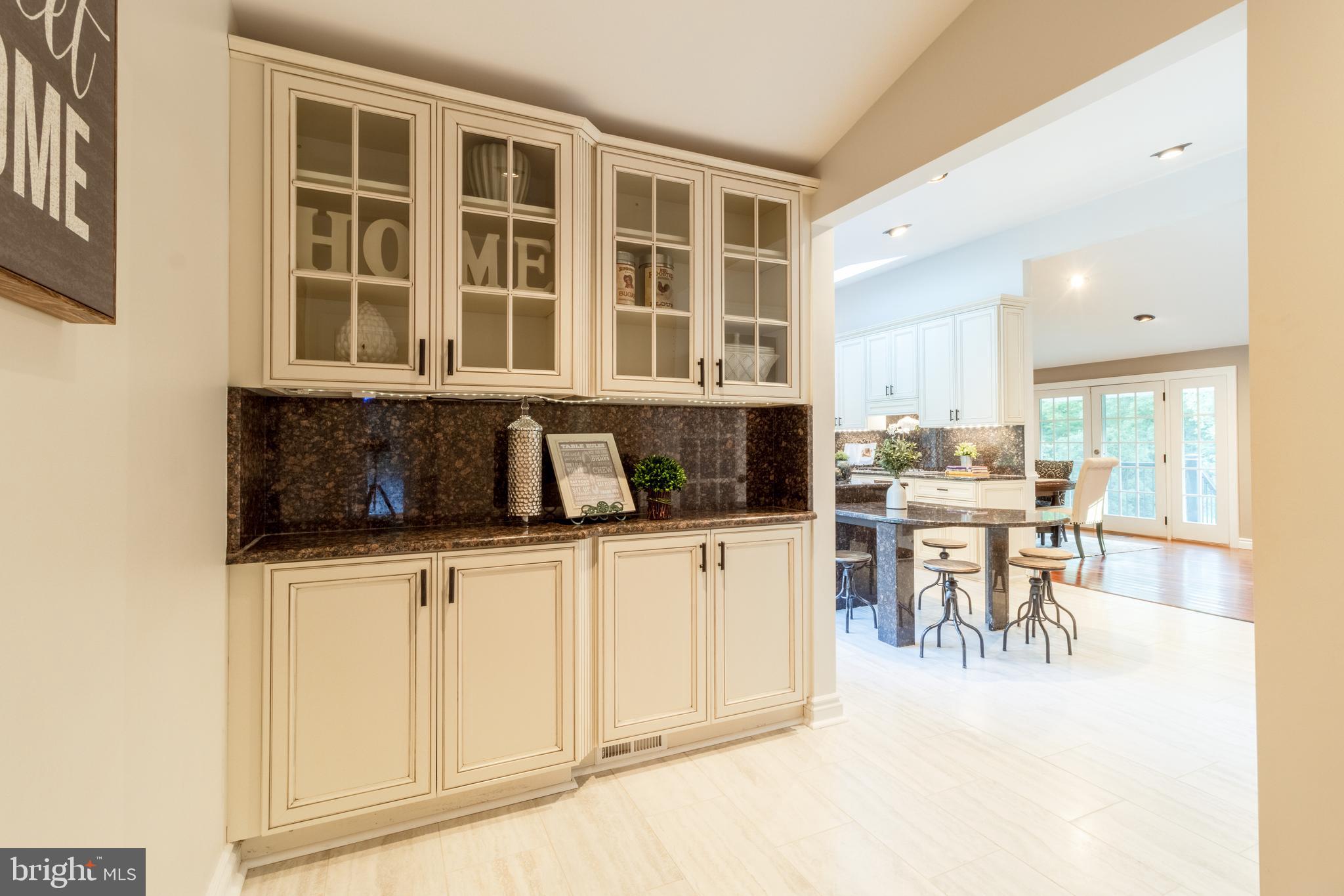 5402 Kennett Pike Wilmington, DE 19807 - Photo 29 of 81 a kitchen with a dining table chairs and large window