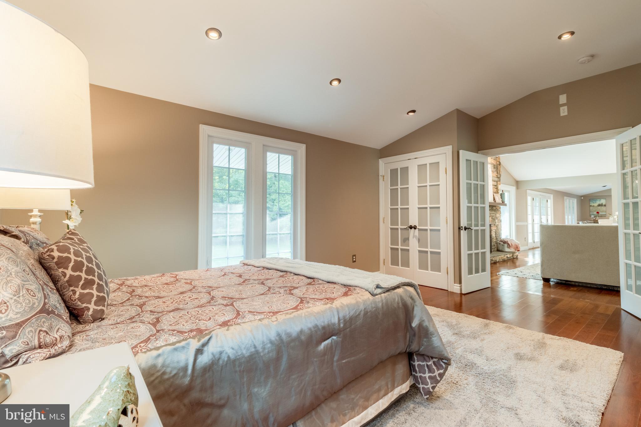 5402 Kennett Pike Wilmington, DE 19807 - Photo 32 of 81 a spacious bedroom with a large bed and a large window