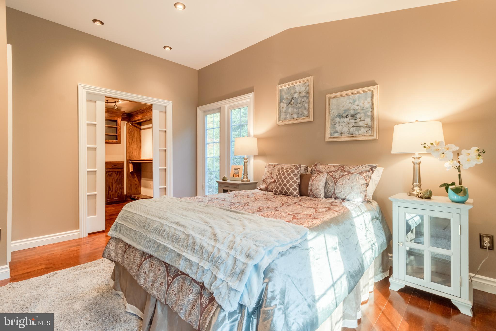 5402 Kennett Pike Wilmington, DE 19807 - Photo 35 of 81 a bedroom with a large bed and a window