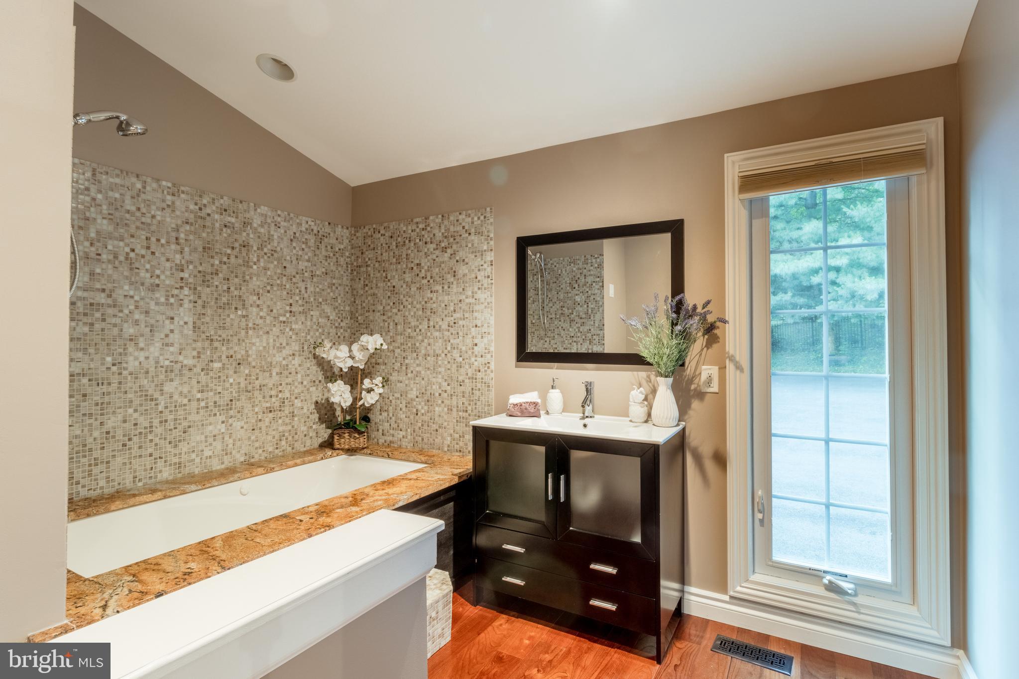 5402 Kennett Pike Wilmington, DE 19807 - Photo 42 of 81 a bathroom with a sink and a mirror