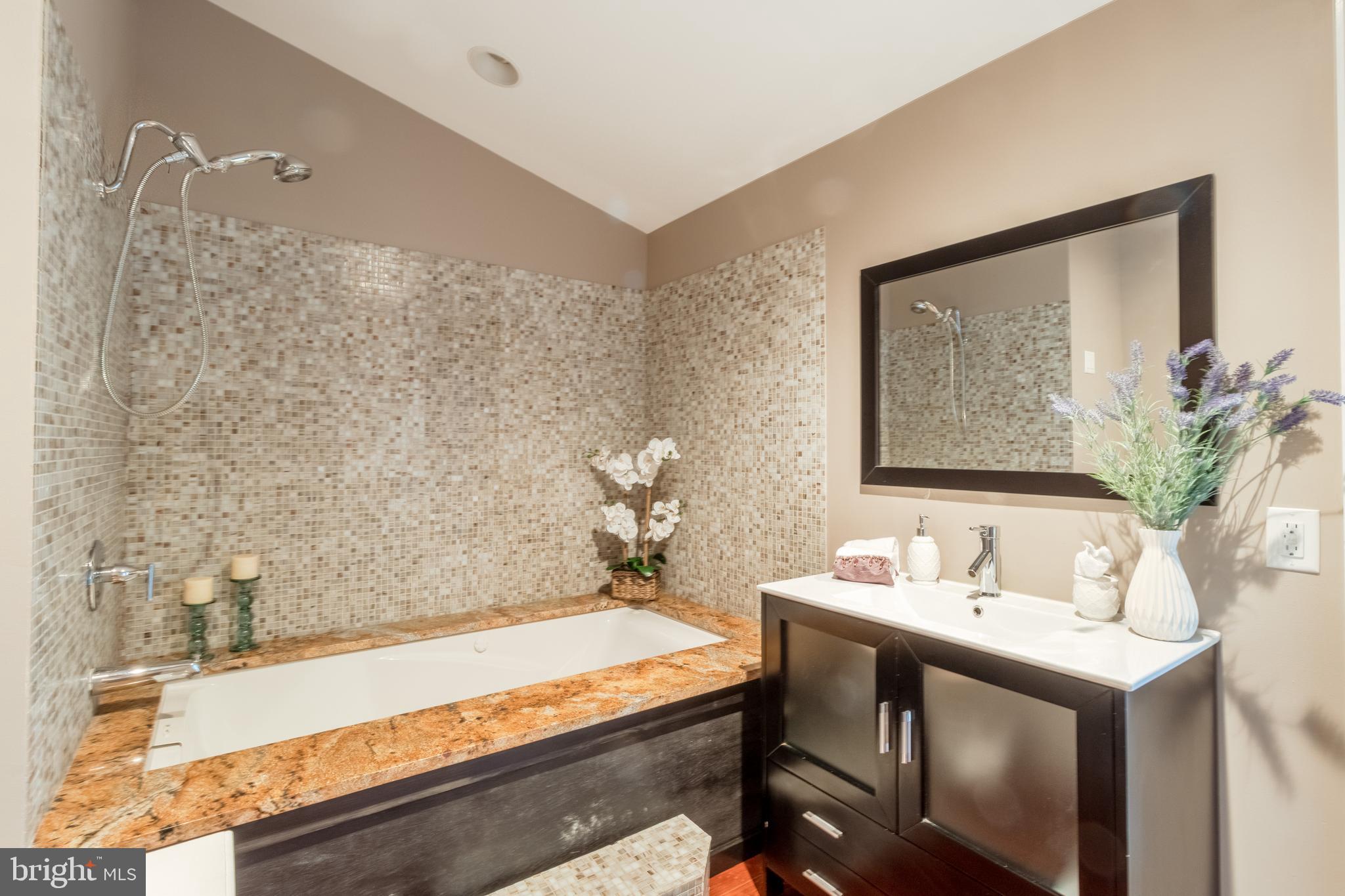 5402 Kennett Pike Wilmington, DE 19807 - Photo 43 of 81 a bathroom with a sink and a mirror