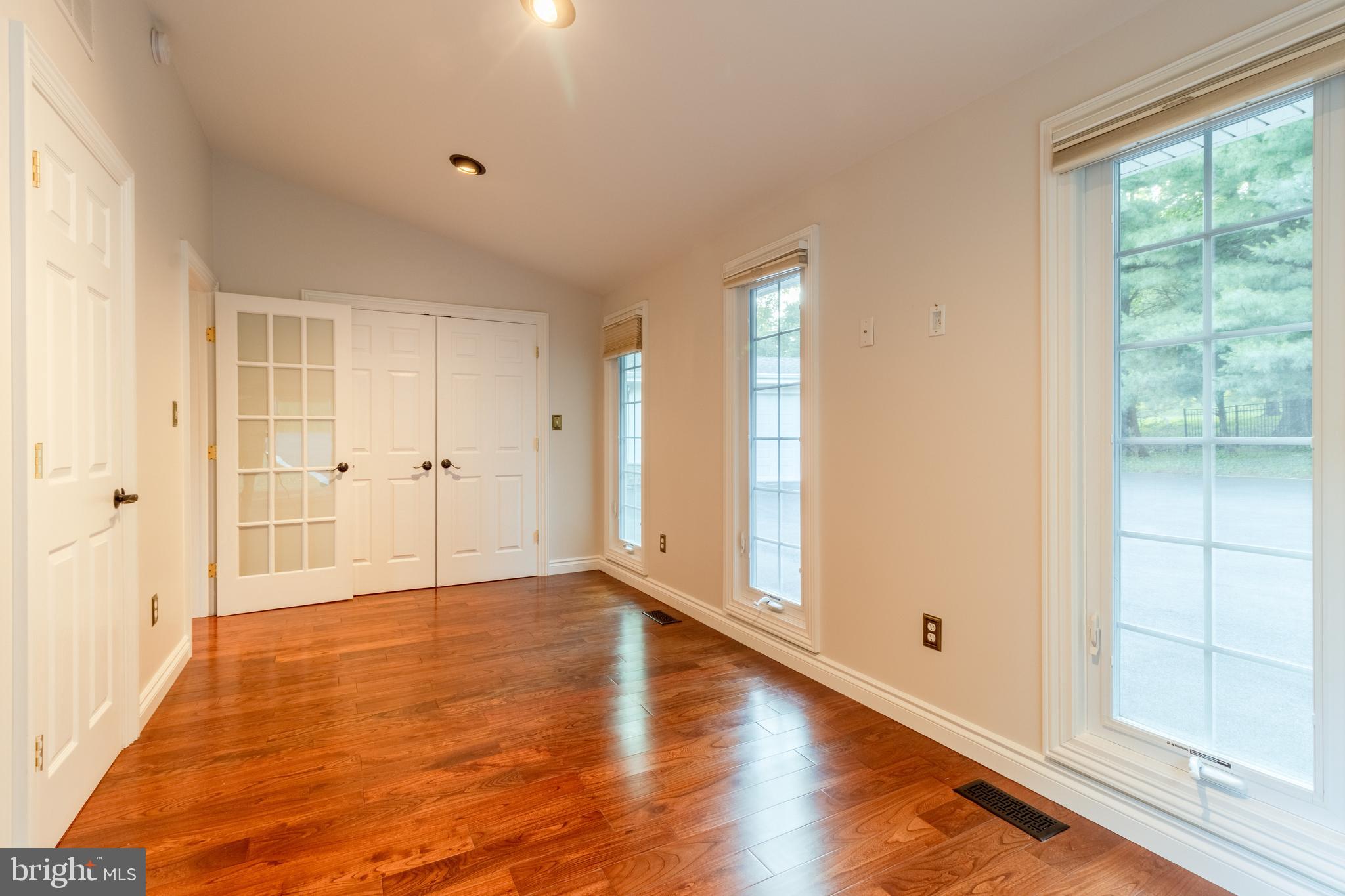 5402 Kennett Pike Wilmington, DE 19807 - Photo 48 of 81 a view of an empty room with wooden floor and a window