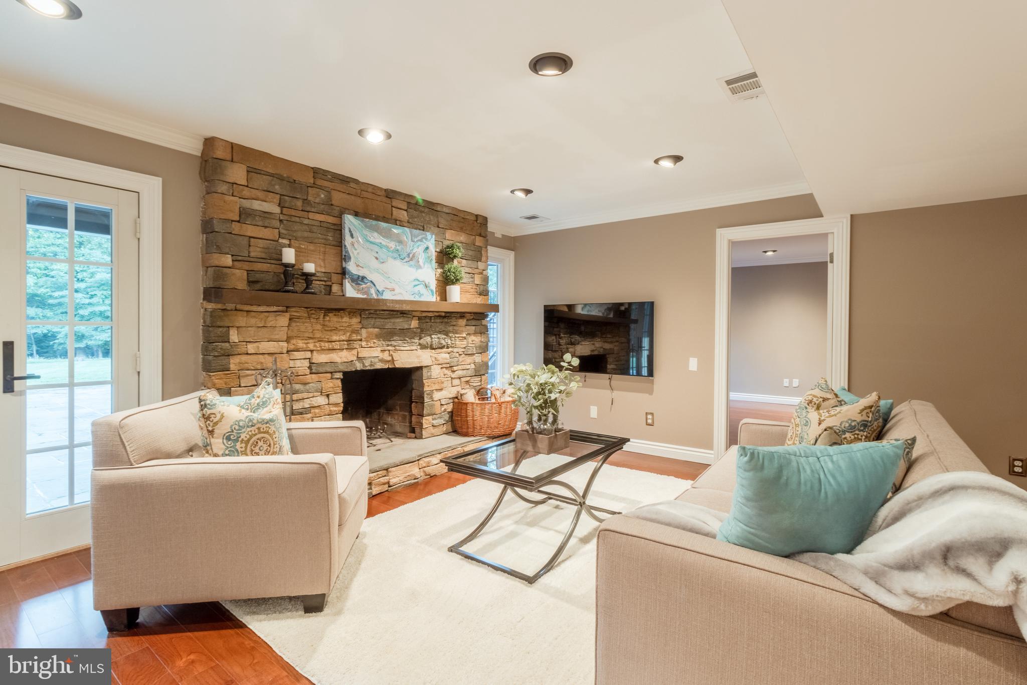 5402 Kennett Pike Wilmington, DE 19807 - Photo 54 of 81 a living room with furniture and a fireplace