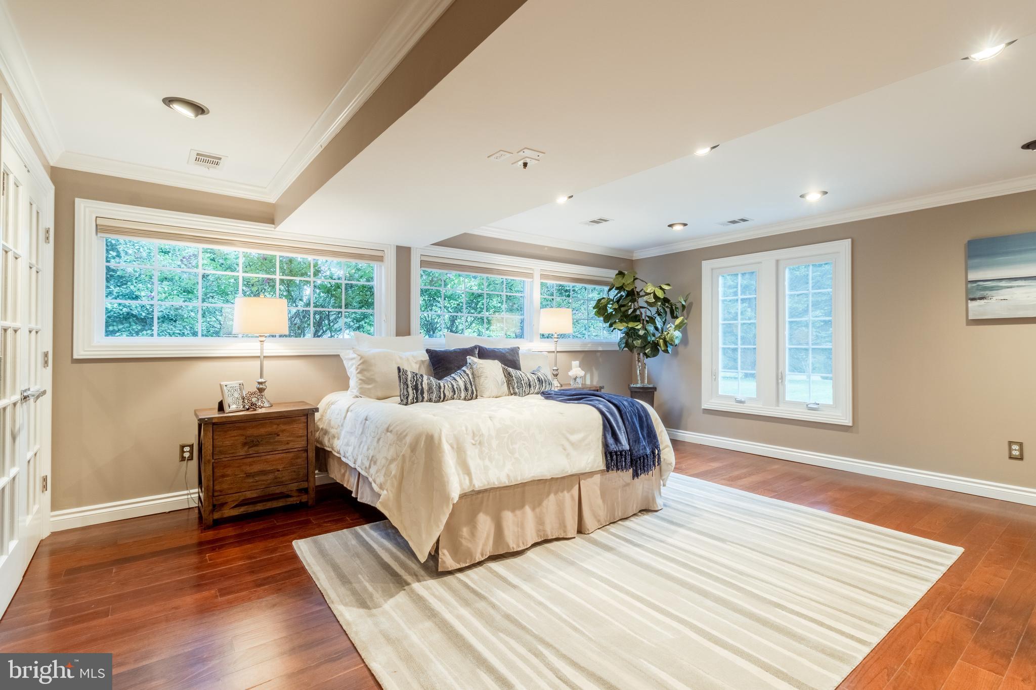 5402 Kennett Pike Wilmington, DE 19807 - Photo 57 of 81 a bedroom with a large bed and a large window