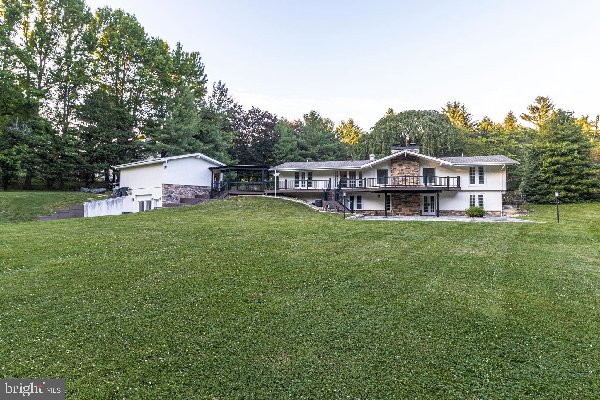 5402 Kennett Pike Wilmington, DE 19807 - Photo 77 of 81 a view of a house with a big yard and large trees