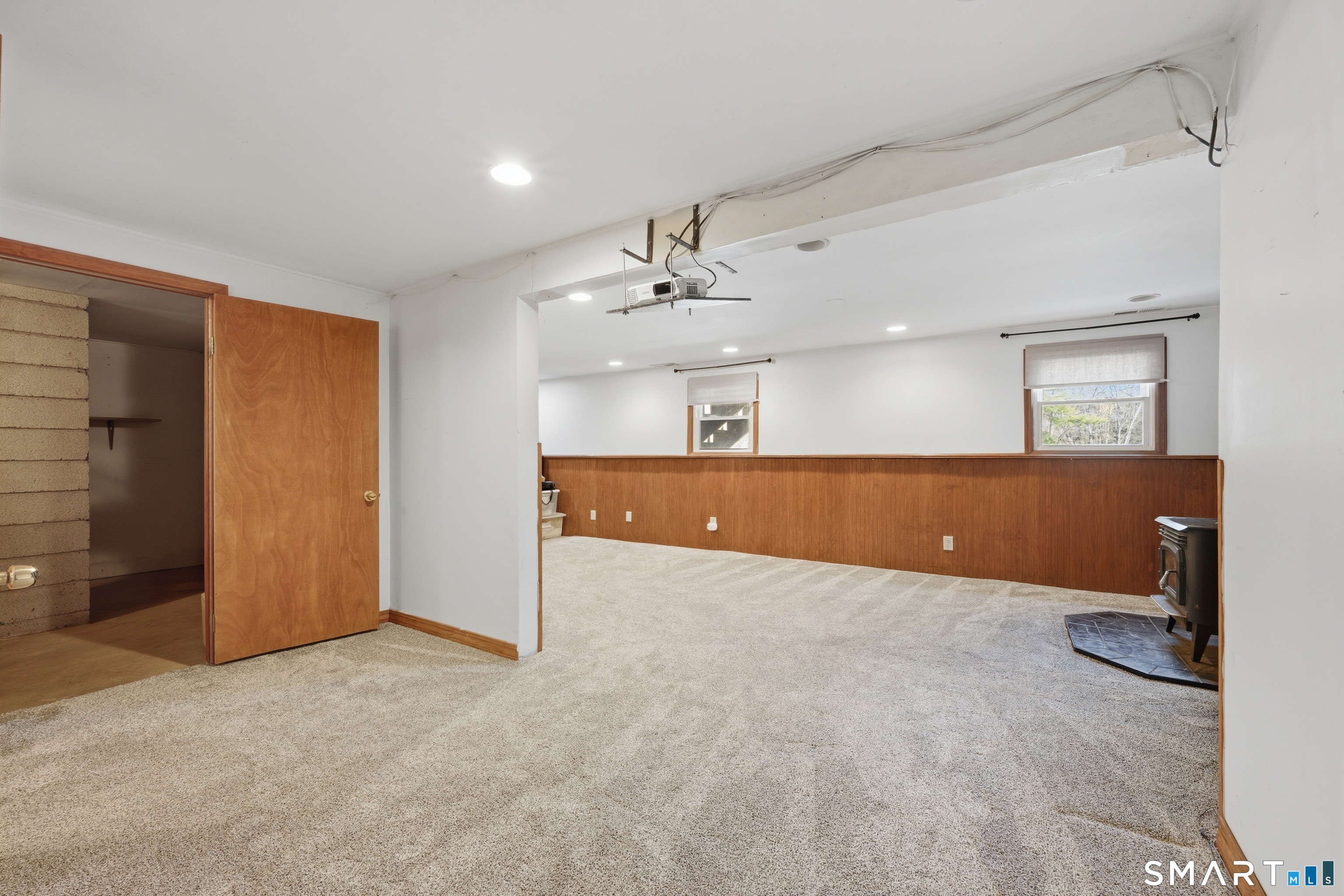114 Beacon Valley Road Beacon Falls, CT 06403 - Photo 26 of 38 an empty room with a mirror and a ceiling fan