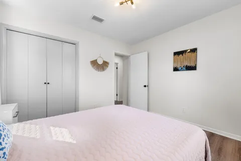 a bedroom with a bed and a shower