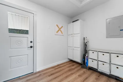 a view of a storage & utility room with closet window