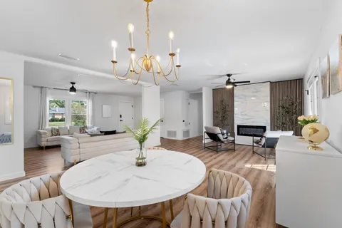 a very nice looking dining room with furniture