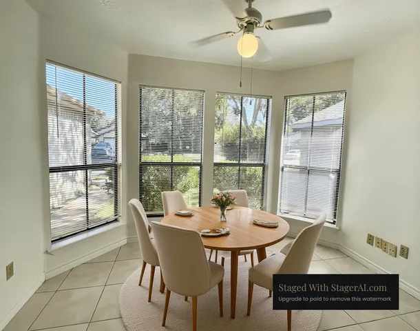 a view of a dining room with furniture window and outside view