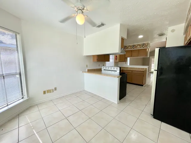 a kitchen with stainless steel appliances cabinets a sink and a counter top space