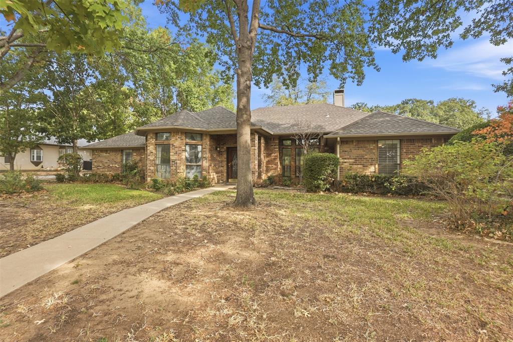 37 Timbergreen Circle Denton, TX 76205 - Photo 3 of 31 Brick exterior with a gabled roof and a paved walkway