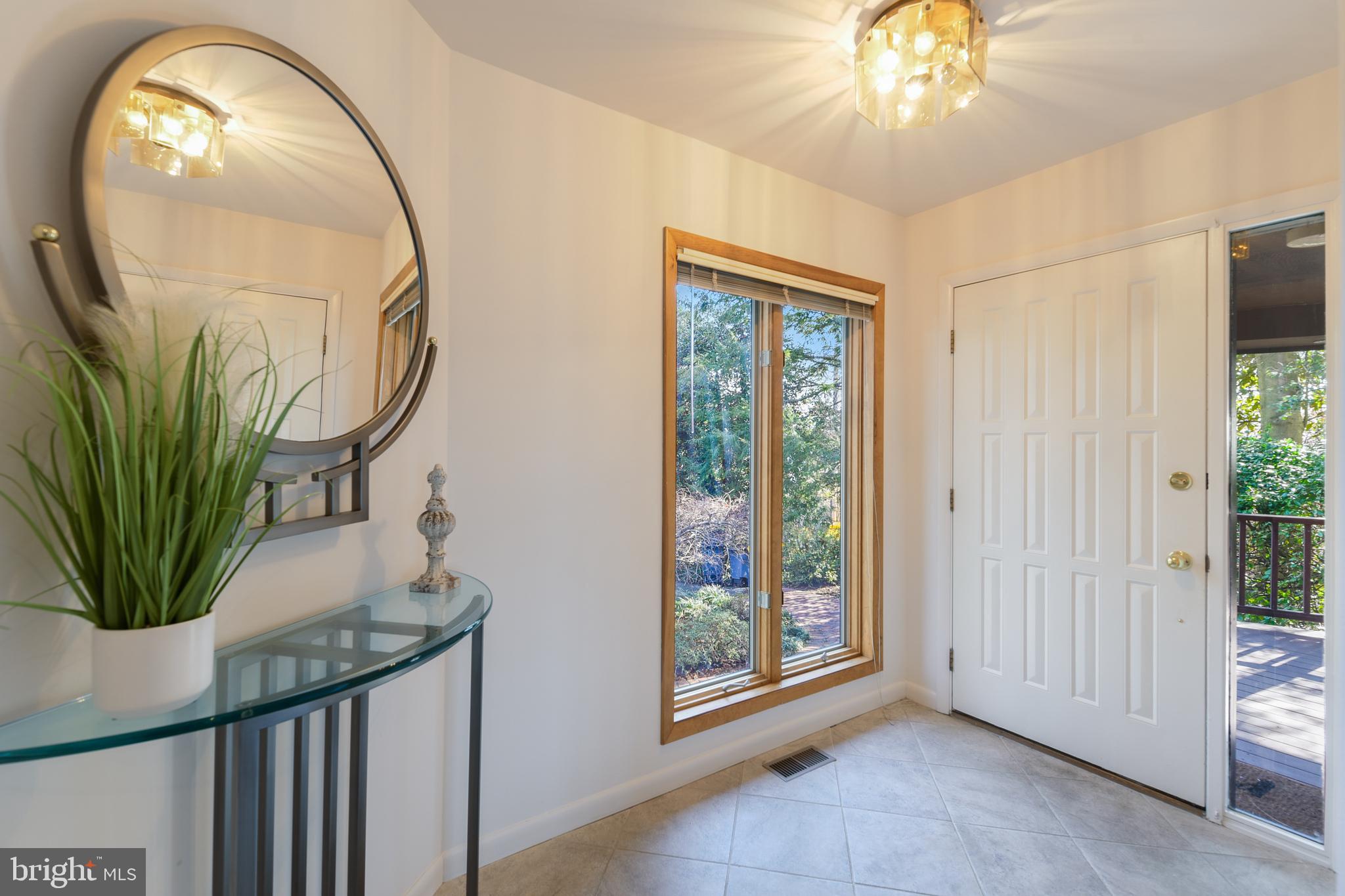 245 Long Point Road Crownsville, MD 21032 - Photo 13 of 53 a view of a hallway with a chandelier