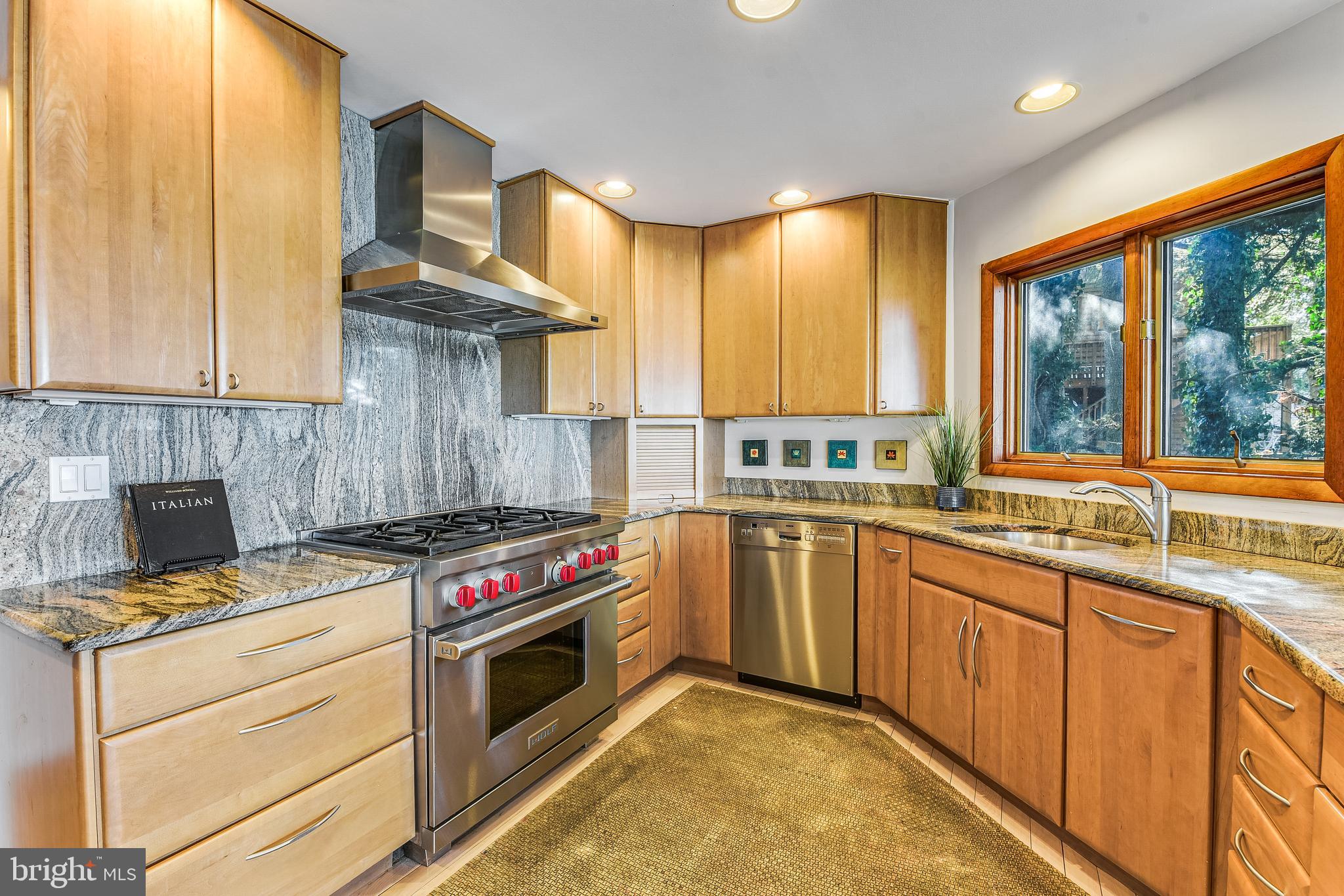 245 Long Point Road Crownsville, MD 21032 - Photo 22 of 53 a kitchen with stainless steel appliances granite countertop a stove a sink and a microwave