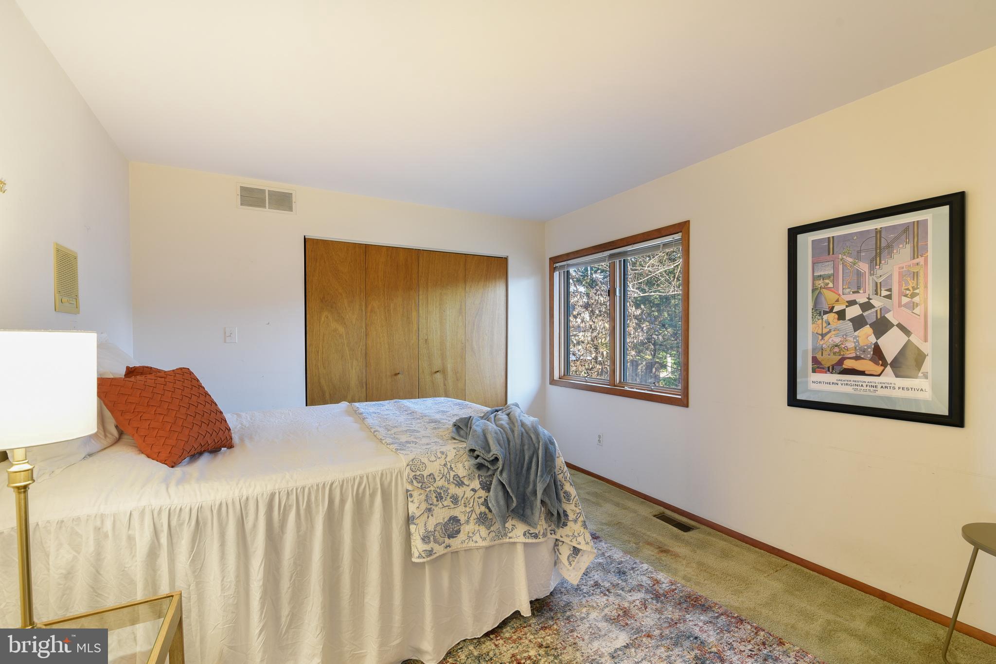 245 Long Point Road Crownsville, MD 21032 - Photo 25 of 53 a bedroom with a bed and the painting on the wall