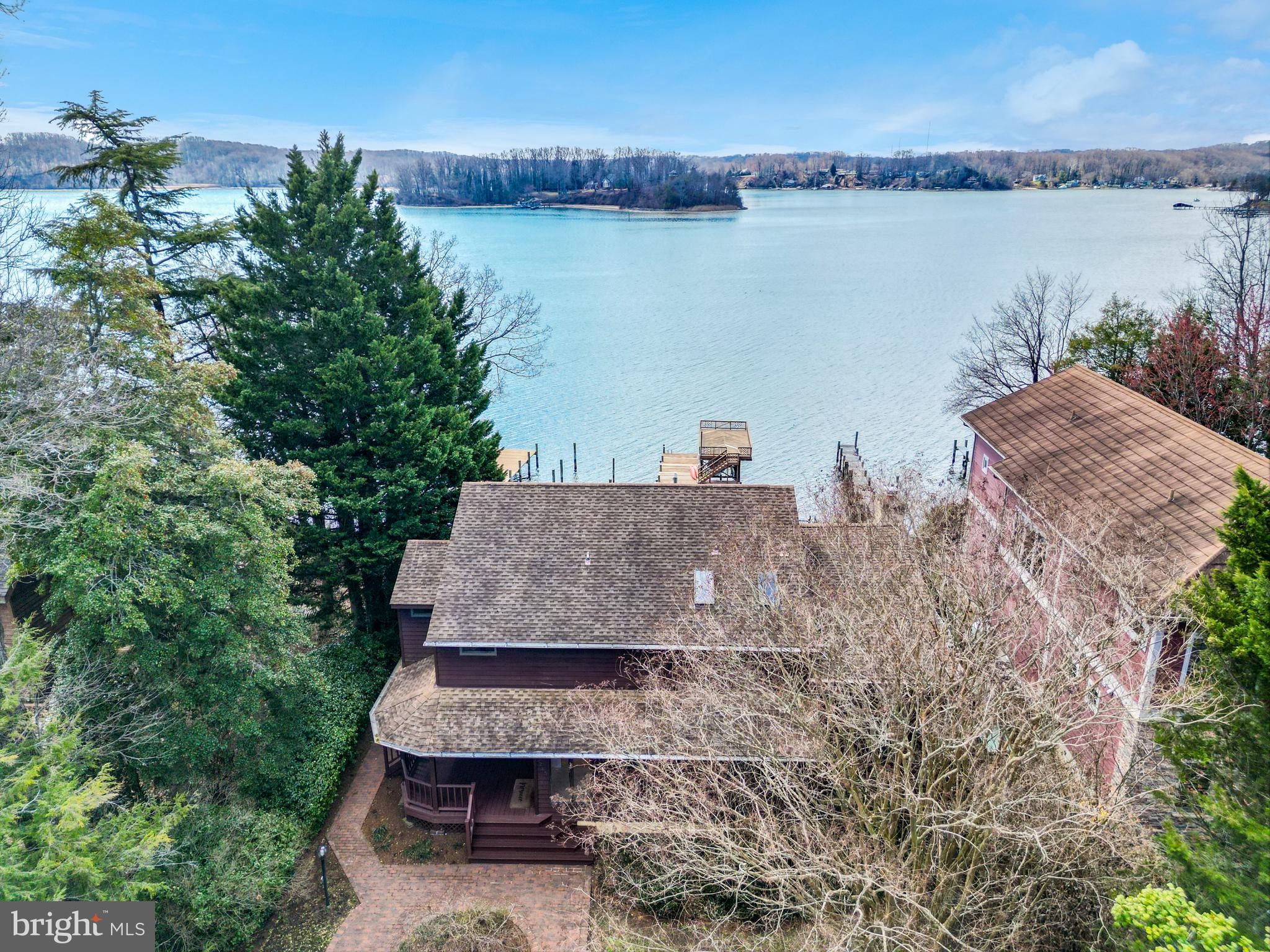 245 Long Point Road Crownsville, MD 21032 - Photo 49 of 53 a aerial view of a house with a garden and lake view